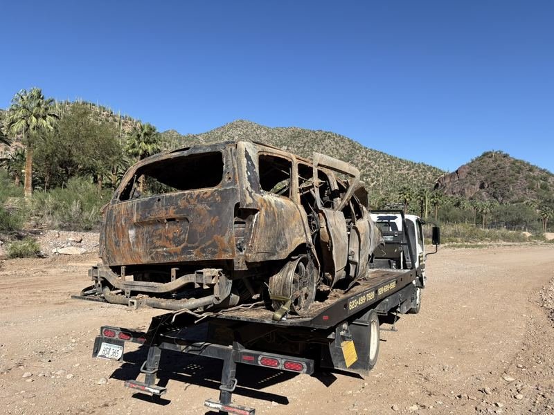 Burned-out vehicle recovered off a desert road