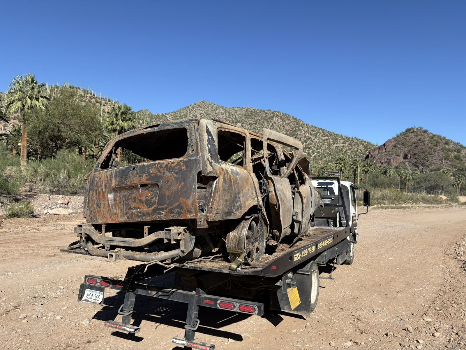 Burned-out vehicle recovered off a desert road